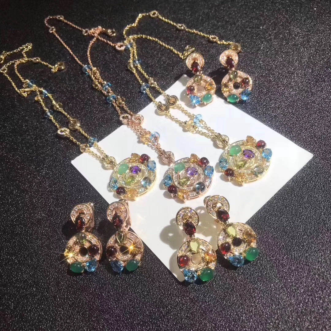 Bulgari Astrale large pendant necklace in 18 kt yellow gold with gemstones